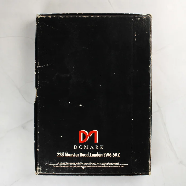 Az Eureka! videójáték dobozának fekete hátoldala a Domark logóval és címével.