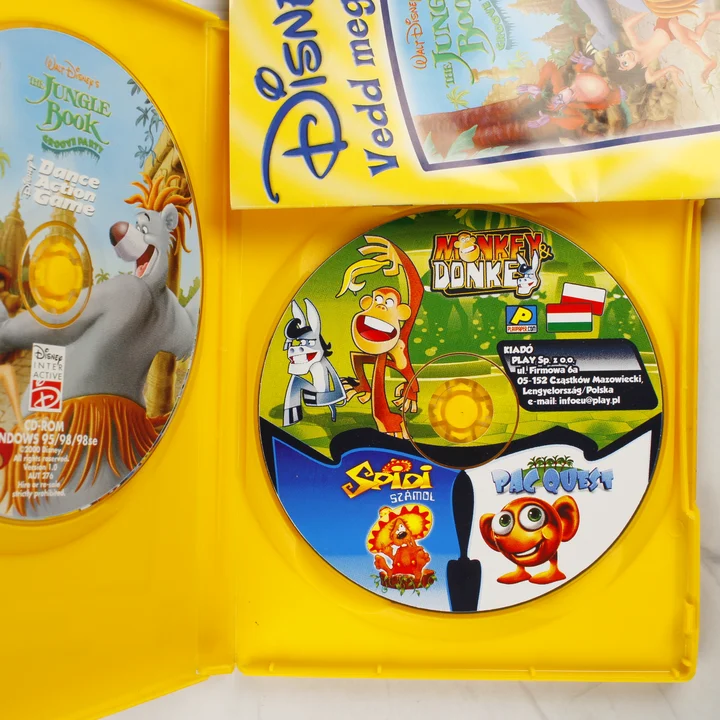 A nyitott sárga tok a két CD-ROM lemezzel és a kézikönyvvel