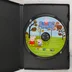 A Peppa Pig: Puddles of Fun színes CD-ROM lemeze a nyitott fekete műanyag tokban