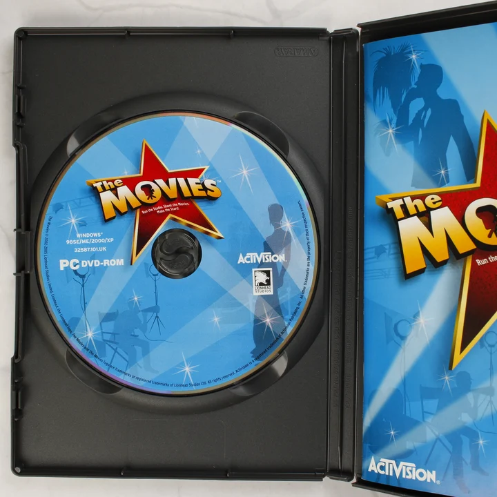 The Movies PC játék belső A nyitott tok a The Movies DVD-lemezzel és a kézikönyv szélével