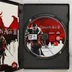 A nyitott Dragon Age II játéktok a DVD-lemezzel és a füzettel