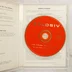 A nyitott tokban lévő piros Xplosiv CD-ROM lemez és a kiskönyv