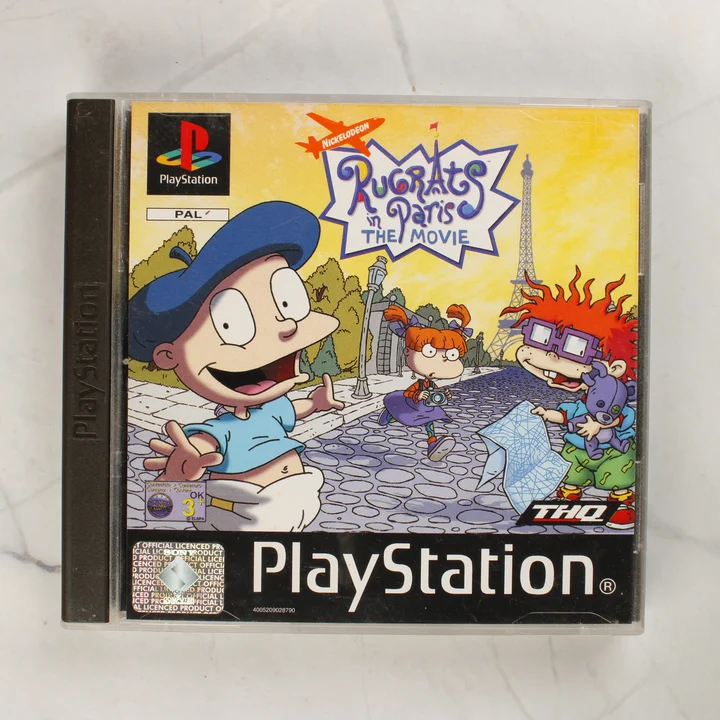 Rugrats in Paris: The Movie PS1 játék előlap A Rugrats in Paris: The Movie PlayStation játék előlapja a műanyag tokban