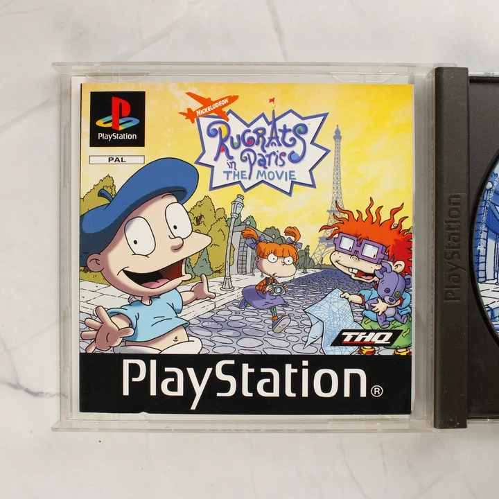 Rugrats in Paris: The Movie PS1 kiskönyv A Rugrats in Paris: The Movie játék kiskönyvének borítója