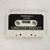 A Squirm játék szürke színű Commodore 16 kazettája fekete címkével