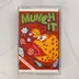 Munch-It videójáték kazetta tokban, elölnézetből