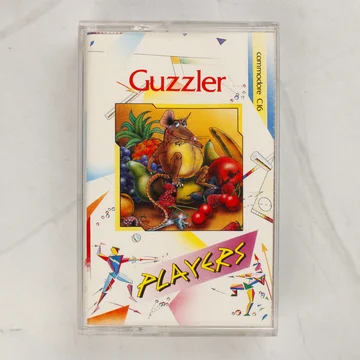 A Guzzler Commodore C16 videójáték tokban lévő borítójának elölnézete