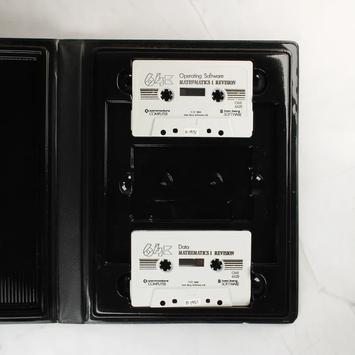 Mathematics 1 C64 kazetták Két fehér magnókazetta a fekete műanyag tokban
