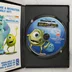 A Monsters, Inc. Scream Alley PC játék kinyitott tokja a CD-ROM lemezzel és a füzettel
