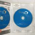 A SpellForce: The Order of Dawn kinyitott műanyag tokja a két kék CD-ROM lemezzel és a termékkulccsal