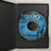 Nyitott fekete műanyag tok a Zoo Tycoon CD-ROM lemezzel
