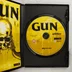 Nyitott DVD-tok a Gun lemezzel és a füzettel
