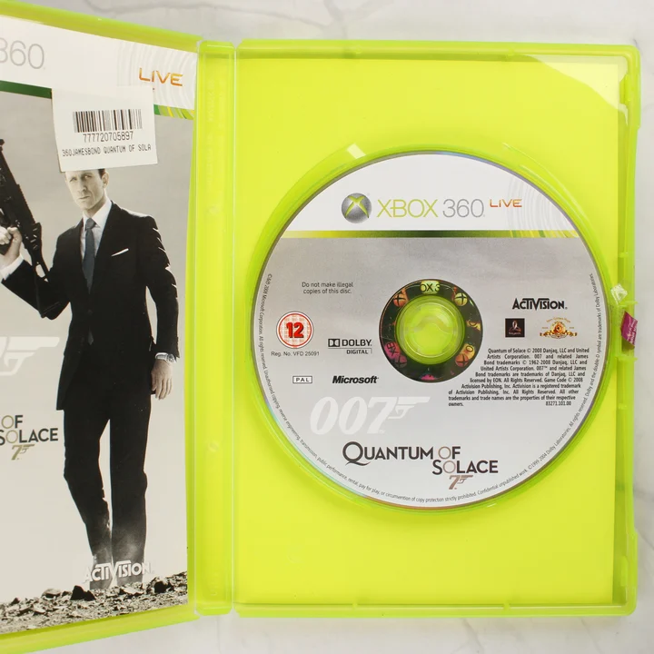 007 Quantum of Solace Xbox 360 nyitott tok és lemez A Quantum of Solace Xbox 360 játék nyitott műanyag tokja a lemezzel és a kiskönyvvel