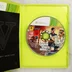 Nyitott Xbox 360 tok a Grand Theft Auto V játéklemezzel és füzettel