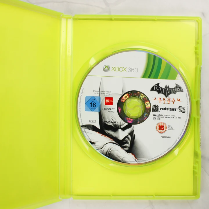 Batman: Arkham City játéklemez a nyitott Xbox 360 tokban