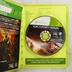 Nyitott Xbox 360 tok a Gears of War Judgment lemezzel és a füzettel