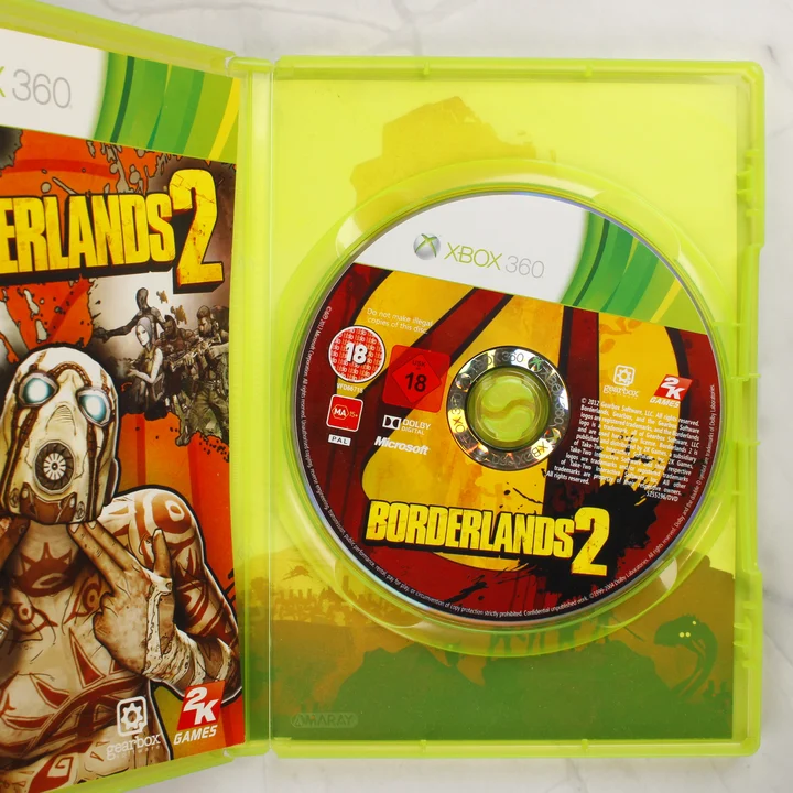 Borderlands 2 Xbox 360 nyitott tok lemezzel Nyitott Xbox 360 tok a Borderlands 2 játéklemezzel és a füzettel