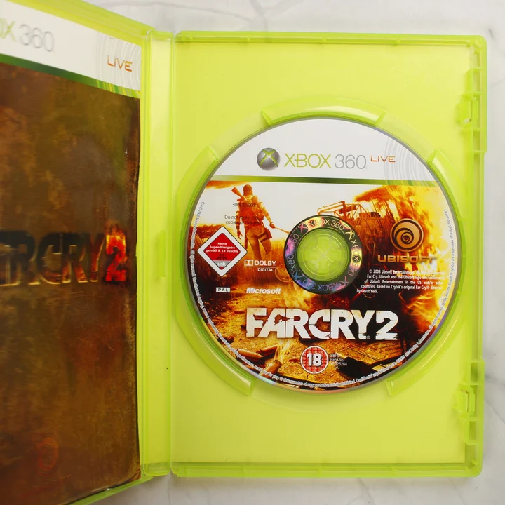 Far Cry 2 Xbox 360 tok belseje lemezzel Nyitott Xbox 360 tok a Far Cry 2 játéklemezzel és kézikönyvvel