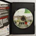 A FIFA 12 Xbox 360 kinyitott tokja a játéklemezzel és melléklettel