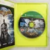 Nyitott Xbox 360 tok a Batman Arkham Asylum játéklemezzel és kiskönyvvel