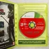 Nyitott Xbox 360 tok a lemezzel és a füzettel