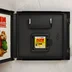 A Nintendo DS tok belseje a játékkazettával és a füzettel
