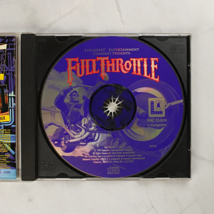Full Throttle Mac CD-ROM lemez és nyitott tok Full Throttle kék-ezüst Mac CD-ROM lemez a nyitott tokban
