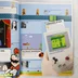 A könyv belső oldala a klasszikus Super Mario pillanatokról és a Game Boy gépről