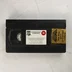 Fekete Commando VHS videokazetta matricával és címkével