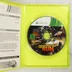 Nyitott tok a Need for Speed The Run Xbox 360 játéklemezzel és a füzettel