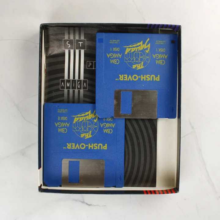 Push-Over Amiga tartalom Push-Over Amiga floppy lemezek és kézikönyv a dobozban