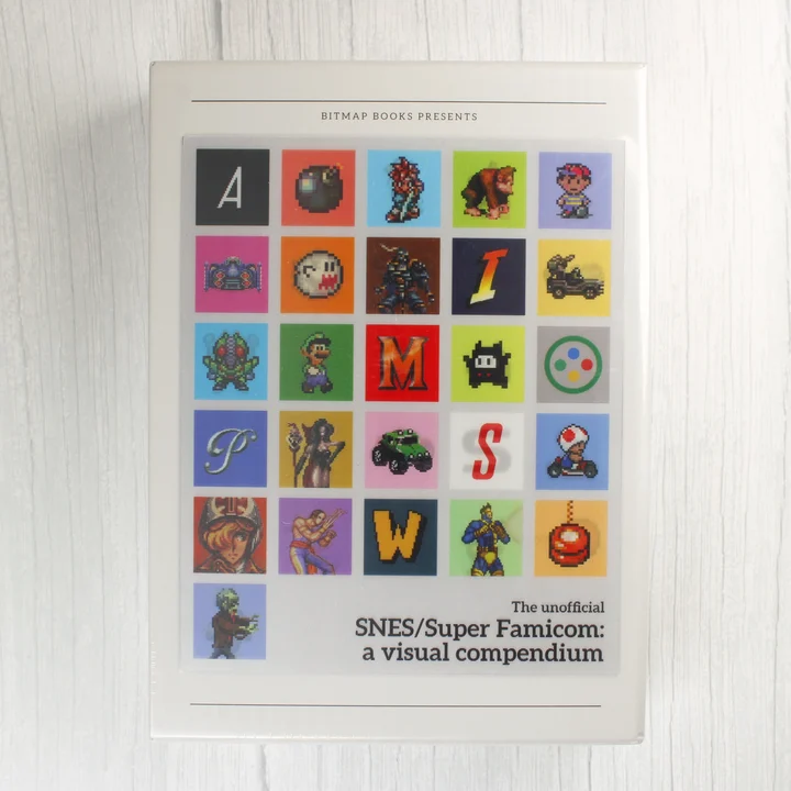A SNES/Super Famicom: a visual compendium könyv előlapja pixel art karakterekkel