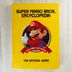 A Super Mario Bros. Encyclopedia sárga keménytáblás borítója Marióval