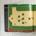 Nyitott könyvoldal a The Legend of Zelda játékmenet képével