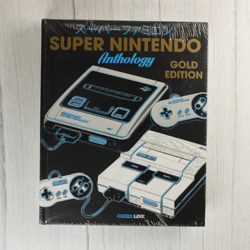 A Super Nintendo Anthology Gold Edition könyv előlapja gyári fóliában.