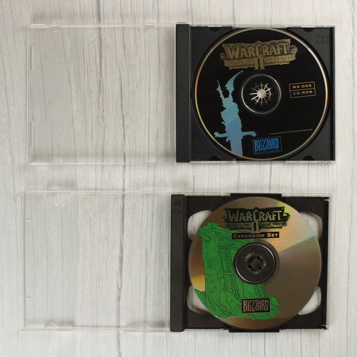 Warcraft II alapjáték és kiegészítő CD-lemezek műanyag tokban