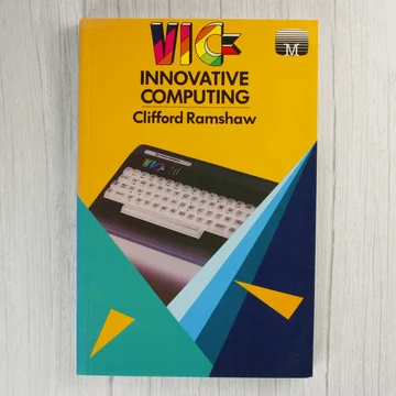A VIC Innovative Computing könyv előlapja sárga háttérrel és egy VIC-20 számítógép képével.