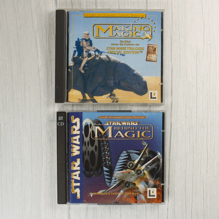 Két CD-tok a Star Wars Behind the Magic és Making Magic lemezekkel