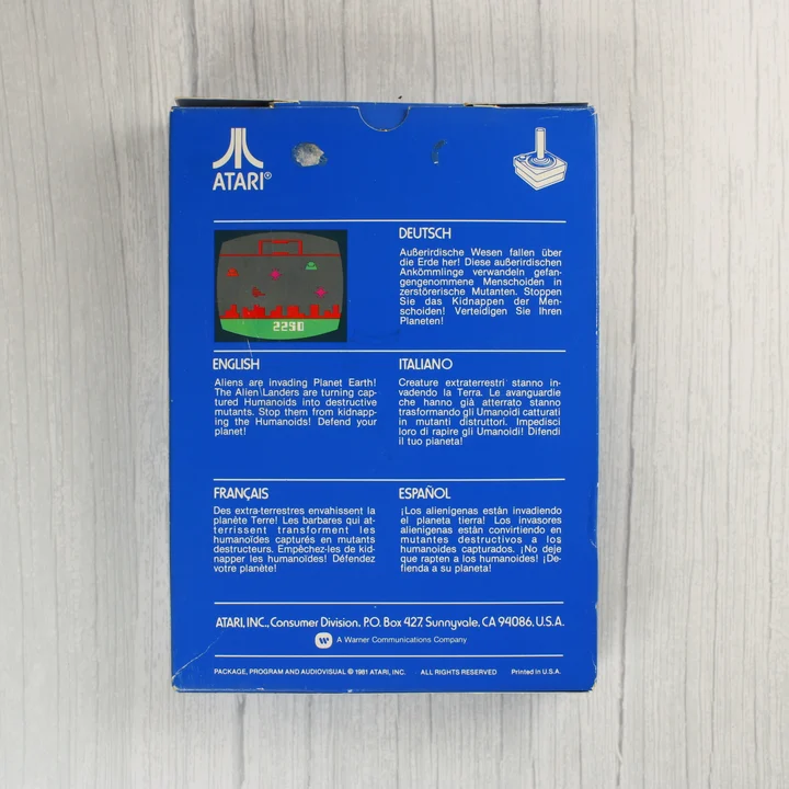 Atari 2600 Defender doboz hátlap Atari 2600 Defender videójáték dobozának hátoldala többnyelvű leírással