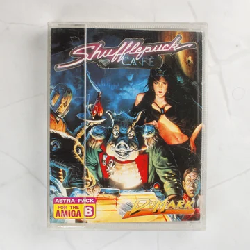 Shufflepuck Café Amiga játék előlapi borítója műanyag tokban