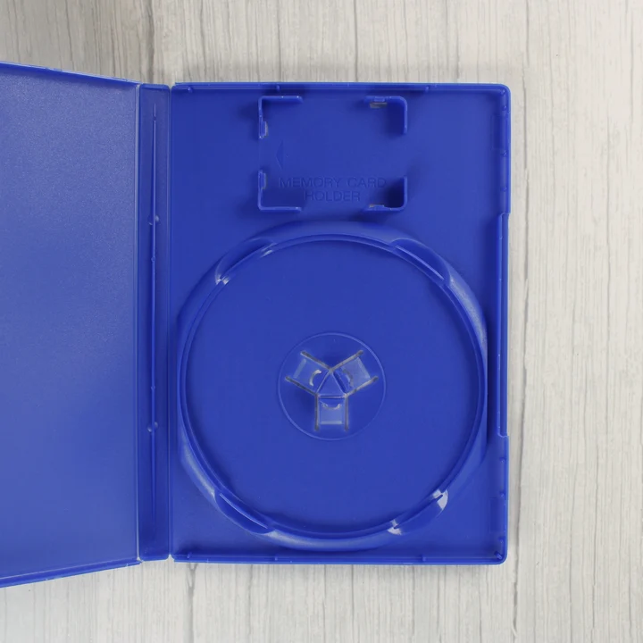Nyitott kék PlayStation 2 videójáték-tok belső nézete