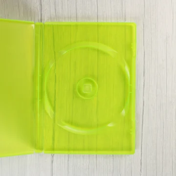 Nyitott, áttetsző zöld Xbox 360 videójáték tok belső nézete