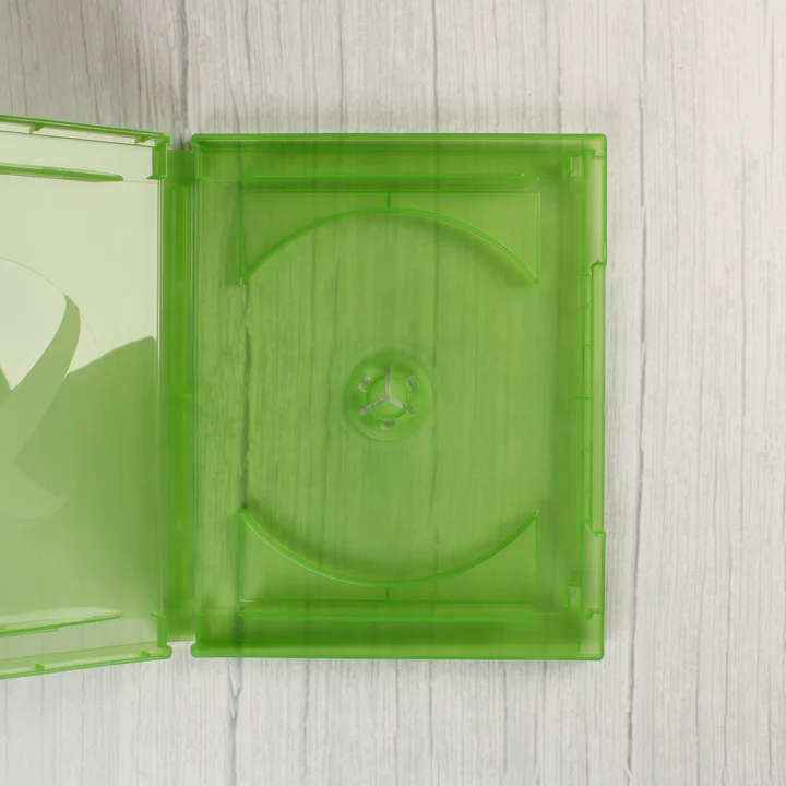 Nyitott áttetsző zöld Xbox One videójáték-tok belső nézete