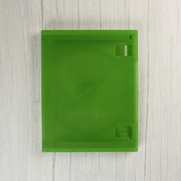 Zárt, áttetsző zöld Xbox One videójáték-tok felülnézetből