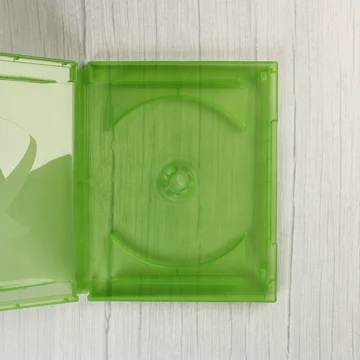 Nyitott áttetsző zöld Xbox One videójáték-tok belső nézete