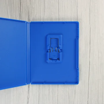 Nyitott kék PlayStation Vita játéktok belső cartridge tartóval
