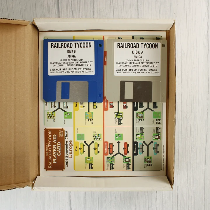 Railroad Tycoon Amiga lemezek Railroad Tycoon Amiga floppy lemezek és segédkártya a dobozban